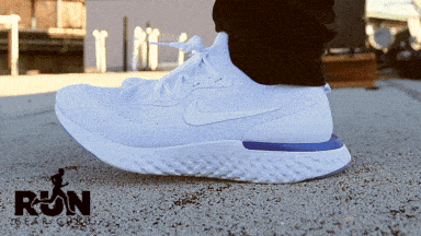 A GIF of a man wearing white shoes on a road