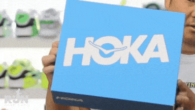 A GIF of a man opening HOKA shoes box