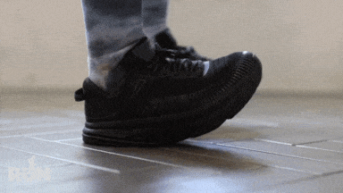 A gif of a man and a woman wearing Hoka shoes